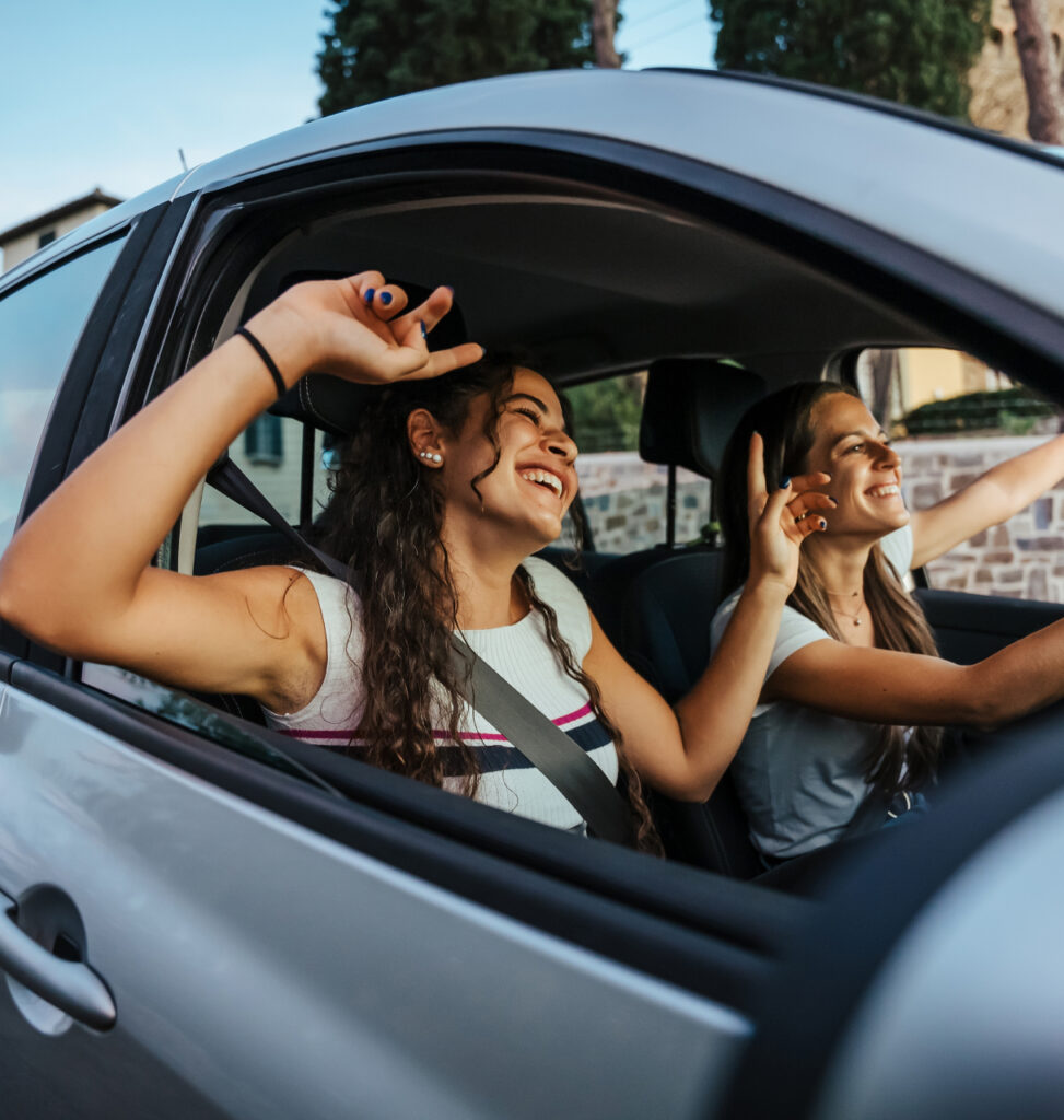 Krasanos Car Rental Crete picture of happy girls driving a car